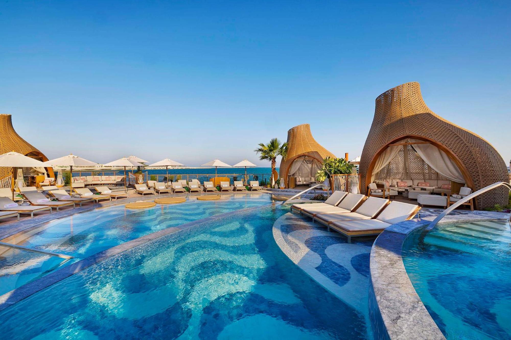 Waldorf Astoria Doha Lusail Bagian luar foto The resort's pool